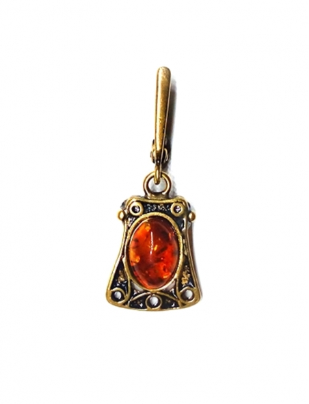 1888 Brass pendant with burned Amber