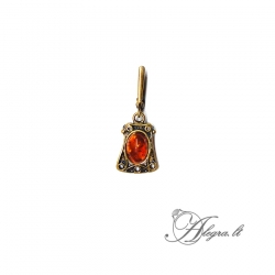 1888 Brass pendant with burned Amber